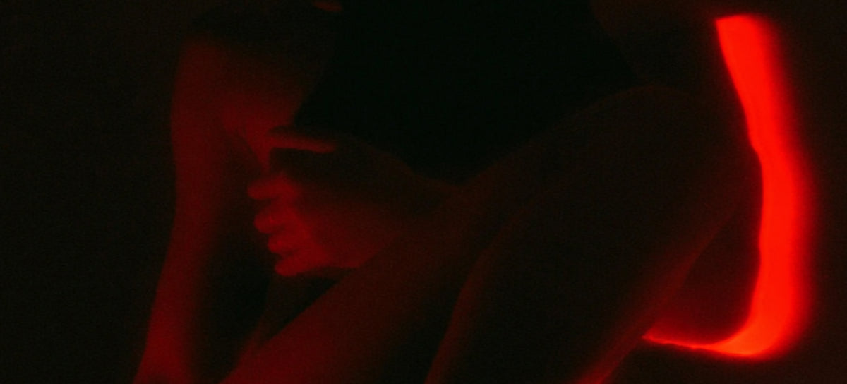 Figure in low red light